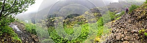 Panorama of Glymur Waterfall canyon hiking path over Botsna river in Iceland