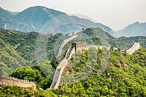 Panorama of Great Wall of China among the green hills and mountains near Beijing, China