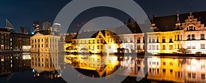Panorama of The Hague at night, historical complex Binnenhof with famous Mauritshuis museum