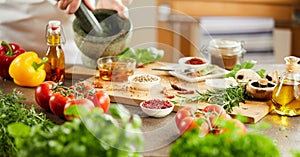 Panorama of the hands of a chef preparing herbs