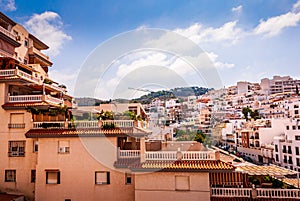 Panorama of hillside houses and apartments at the sunny Costa Tropical town of La Herradura, Granada, Spain photo