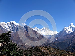 Panorama of Himalayan range behind Phortse village, with snow-capped peaks of Taboche, Everest, Lhotse & Ama Dablam, Nepal