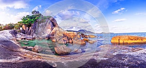 Panorama of Hin Ta Hin Yai with blue sea and sky during summer travel at Koh Samui island, Surat Thani, Thailand