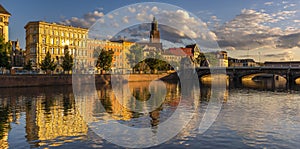 Panorama of the historic district of WrocÅ‚aw seen from the water in the golden hour