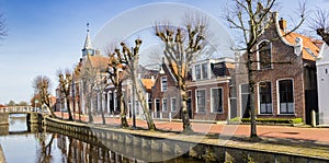 Panorama of historic town hall and old houses at the canal in Balk