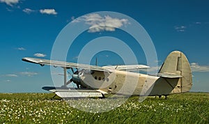 Panorama horizontal; grey plane on the field in parking, airshow