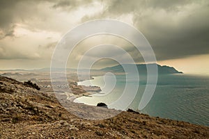 panorama, horizontal view of Crimean mountains with rocky coastline, Black sea before the rain, storm