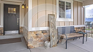 Panorama House exterior with porch and glass paned wooden front door