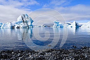 Panorama of icebergs in the lake seen from the beach Iceland Europe