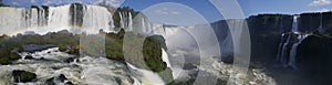 Panorama from Iguazu Falls with a rainbow