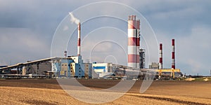 Panorama of industrial landscape environmental pollution waste of thermal power plant. Big pipes of chemical industry enterprise