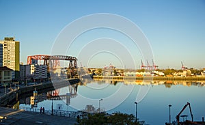 Panorama of the industrial part of La Boca, with cranes of the port and the bridge of Avellaneda in the background. Buenos Aires,