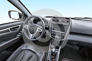 Panorama in interior leather salon of prestige modern car. steering wheel, shift lever and dashboard