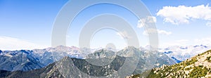 Panorama of Italian Alps with blue sky and cloud. Calm landscape, tranquil scenic view