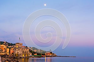 Panorama italian sea village space text and moon high in the sky - Rapallo italy sea town copy space background night