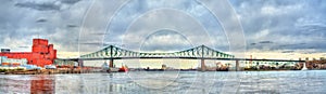 Panorama of Jacques Cartier Bridge crossing the Saint Lawrence River in Montreal, Canada