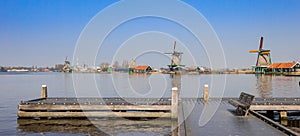 Panorama of a jetty in front of the windmills of Zaanse Schans