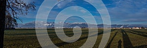 Panorama of Kamnik alps taken from far, from Menges fields in the vicinity of Domzale on a sunny day