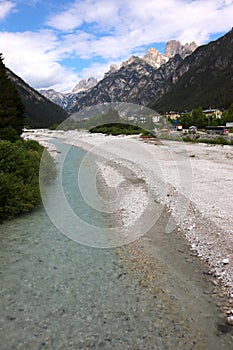 Panorama of Lake Auronzo di Cadore, crystal clear water, delightful village photo