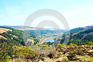 Panorama of Lake Lough Tay or The Guinness Lake. County Wicklow, Wicklow Mountains National Park, Ireland.