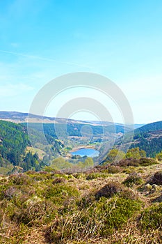 Panorama of Lake Lough Tay or The Guinness Lake. County Wicklow, Wicklow Mountains National Park, Ireland.