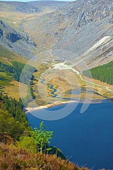 Panorama of Lake Lough Tay or The Guinness Lake. County Wicklow, Wicklow Mountains National Park, Ireland.