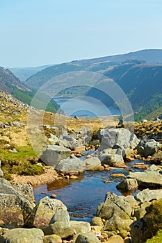 Panorama of Lake Lough Tay or The Guinness Lake. County Wicklow, Wicklow Mountains National Park, Ireland.