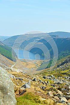 Panorama of Lake Lough Tay or The Guinness Lake. County Wicklow, Wicklow Mountains National Park, Ireland.