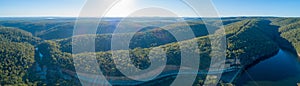 Panorama of Lake Nepean Dam and forested hills.