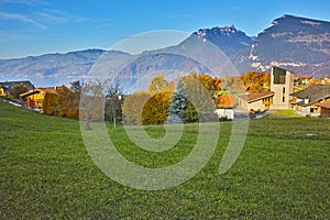 Panorama of Lake Thun and typical Switzerland village near town of Interlaken, canton of Bern