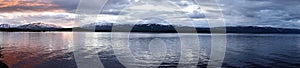 Panorama of Lake Tornetrask at midnight in Abisko National Park in Sweden