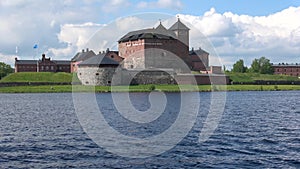 Panorama of lake Vanajavesi with the fortress, june day. Hameenlinna, Finland