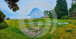 Panorama of lakeside Parco Ciani with scenic flowerbed, Lugano, Switzerland