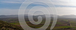 Panorama landscape of brown and green farm fields