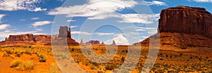 Panorama landscape - Iconic peaks of rock formations in the Navajo Park of Monument Valley