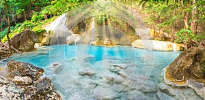 Panorama landscape of lake with cascades of waterfall in tropical forest in Erawan, Thailand