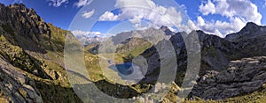 Panorama landscape with a lake in the mountains, huge rocks and