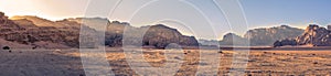 Panorama landscape shot of Wadi Rum desert in Jordan during golden hour