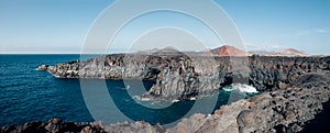 Panorama landscape of unique lava`s caves and ocean