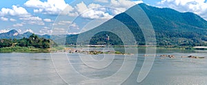 Panorama landscape view of Kaeng Khut Khu set of islets in the middle of Mae Khong River with mountain