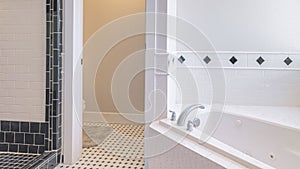 Panorama Large bathroom interior with white and black tiles