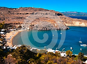 Panorama of Lindos bay from Acropolis.yachts are cruising arround