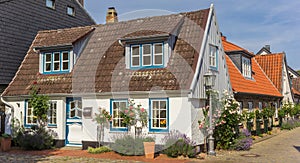 Panorama of a little white house in Holm fishing village in Schleswig