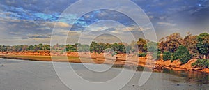 Panorama of the Luangwa River, with a dark dusky cloudy sky, south luangwa, zambia, southern africa