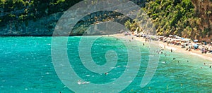 Panorama of Makris Gialos beach in Zakynthos in Greece. People enjoying vacations.