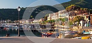 Panorama of Marciana Marina harbour with Monte Cappane mountain photo