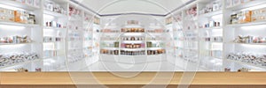 panorama on medicine cabinet and store medicine and pharmacy drugstore for Blurry background with Perspective wood