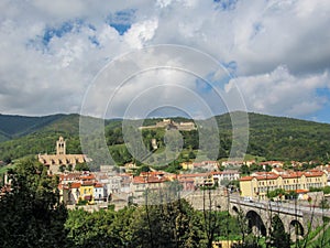 Panorama of medieval walled town of Prats-de-Mollo with church of Saint-Juste-et-Sainte-Ruffine, Fort Lagarde, old stone bridge photo