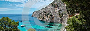 Panorama of Mediterranean Sea turquoise bay rocky mountains in Cala Blanca Andratx, Mallorca, Spain