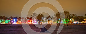 Panorama Miami Beach night neon hotel lights on Ocean Drive
